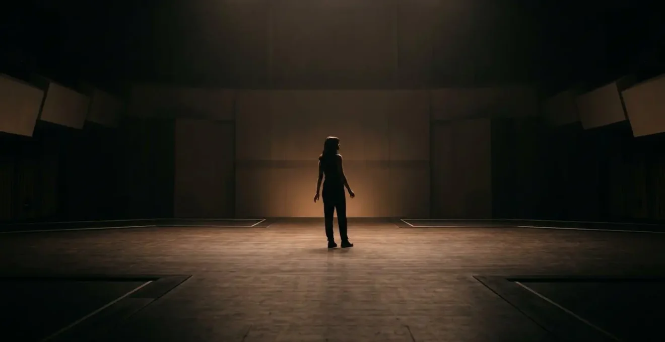Performer in moment of genuine vulnerability and connection on stage