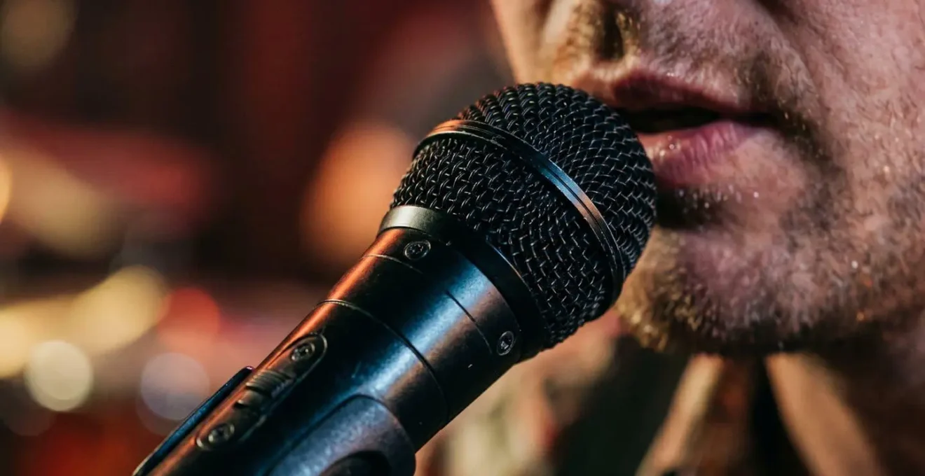 Professional vocal microphone technique demonstrating proximity and intimacy in ballad performance