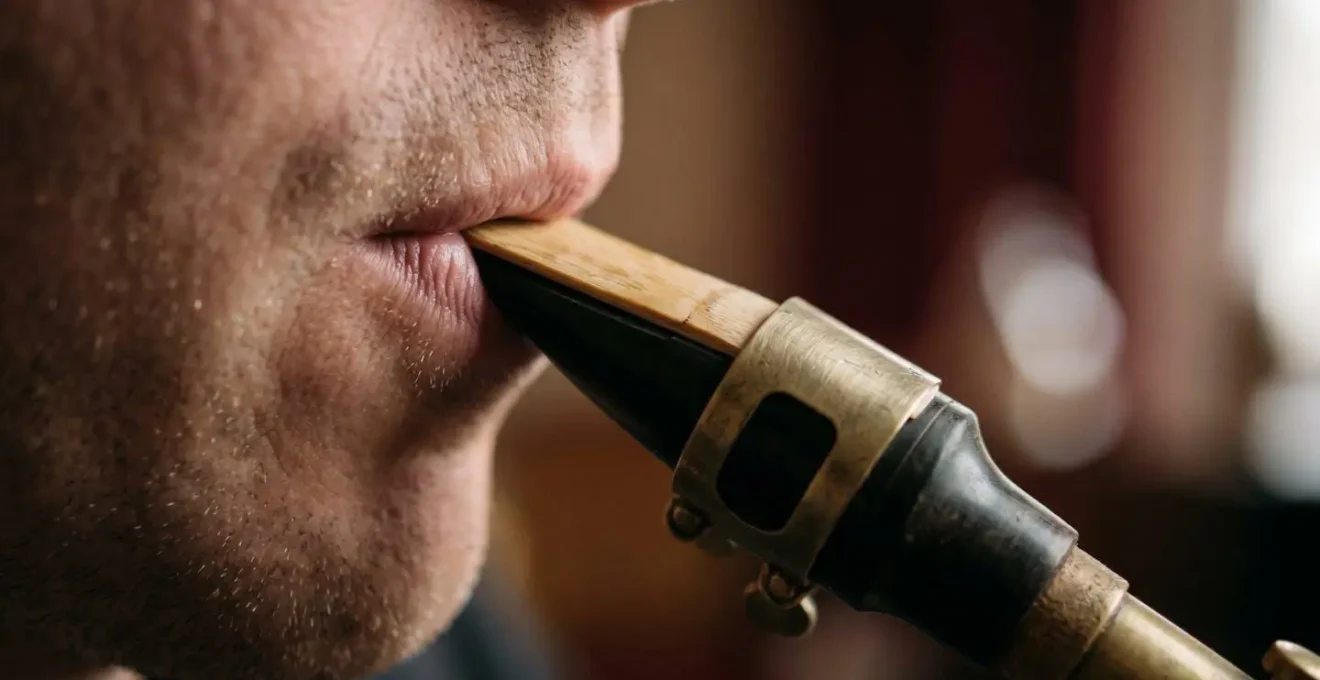 Extreme close-up of saxophone player embouchure showing precise muscle control and reed vibration
