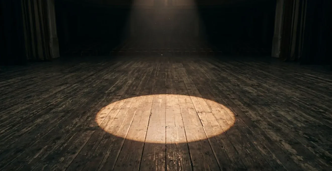 Wide minimalist view of performance space suggesting absence and the passage of time