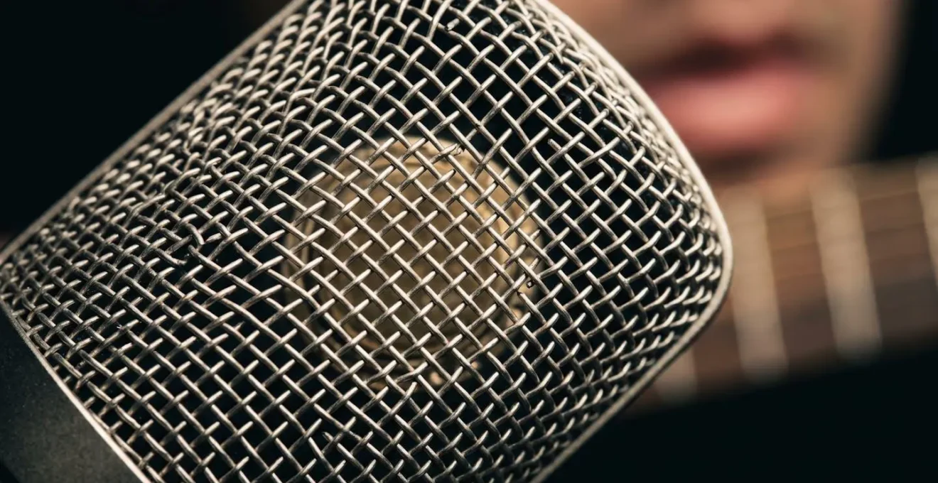 Extreme close-up of microphone diaphragm and sound wave interaction with visible acoustic detail