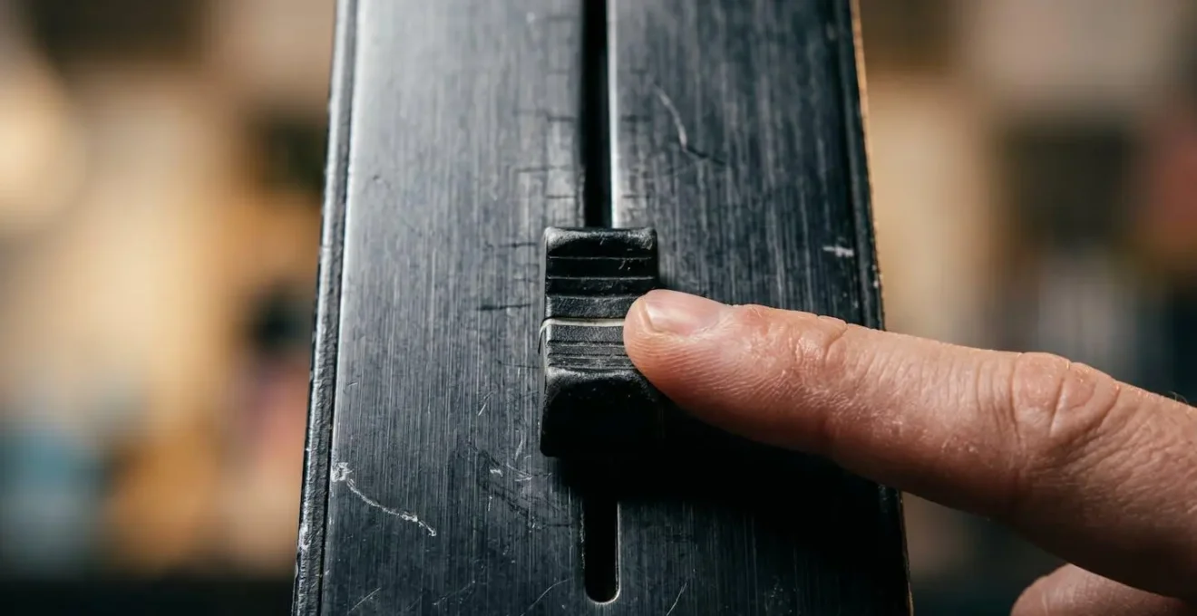 Extreme close-up macro detail of essential audio mixing hardware control surface showing tactile precision