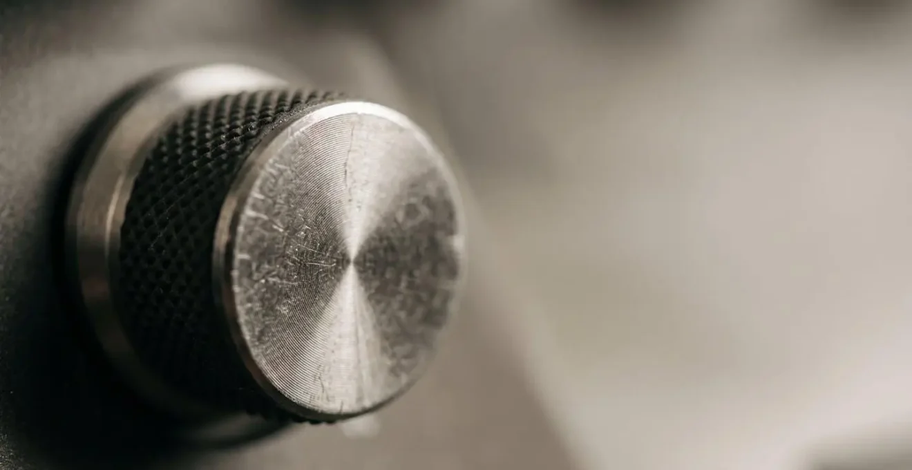 Macro close-up of a single MIDI knob with intentional shallow depth of field, emphasizing focused simplicity over feature abundance