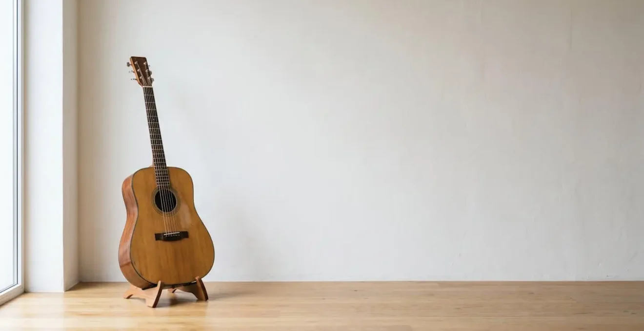A single acoustic guitar in natural light, representing the concept of creative constraint and simplicity in songwriting.